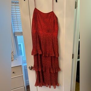 Whistle’s dress- bright orange with small black dots. Great ruffle detail